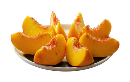 sliced peach on the plateの写真素材