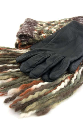 A scarf made of woolen cloth and black gloves.の写真素材