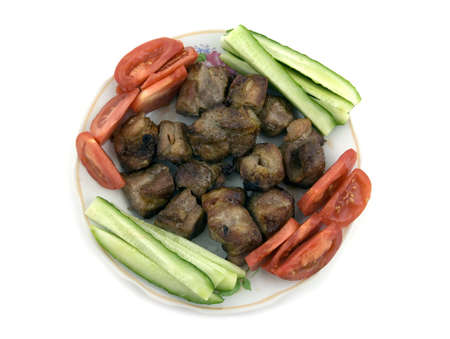 Roasted pork with vegetables on the dish.の写真素材