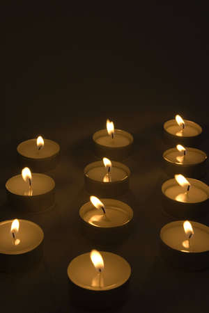 A burning candles placed in three lines. Copyspace provided.の写真素材
