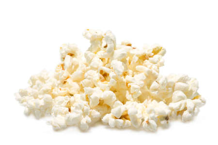 A pile of salted popcorn isolated on white background.の写真素材