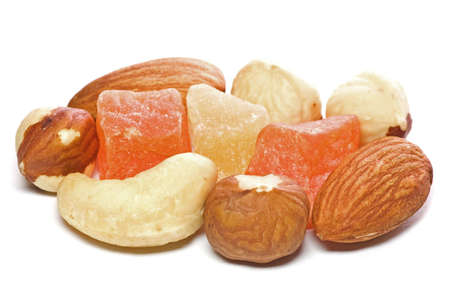 Closeup of dried fruits and nuts isolated on white background.の写真素材