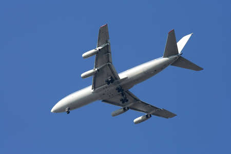 Closeup of airplane in the clear blue sky.