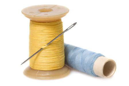Sewing tools - needle and strings. Isolated on white background.
