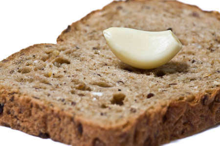 Closeup of garlic slice on the rye bread.の写真素材