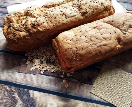loaves of bread on a wooden table
