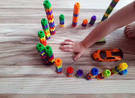 the child's play with colored blocksの写真素材
