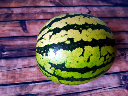 large watermelon on a wooden tableの写真素材