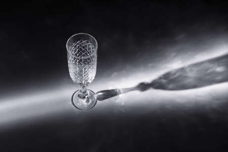 wine glass in light beam side viewの写真素材