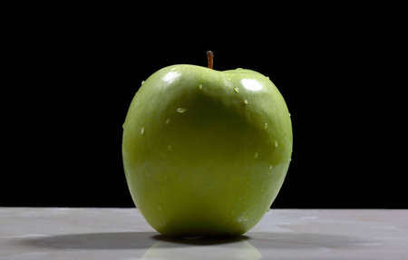 green apple on marble tableの写真素材