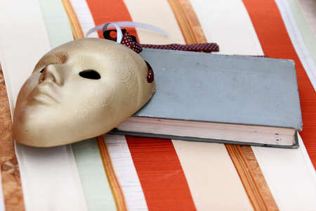 theater mask and old bookの写真素材
