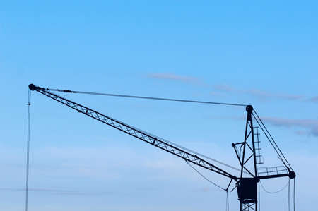 crane tower silhouette on blue sky backgroundの写真素材