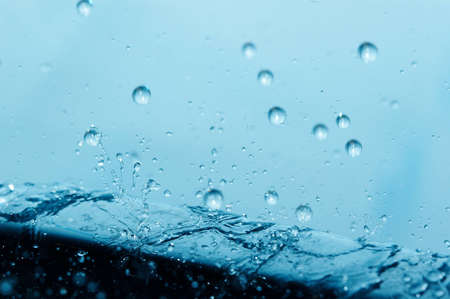 water droplets break by metal surfaceの写真素材