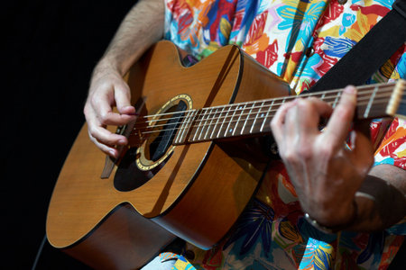 acoustic guitar in man hands