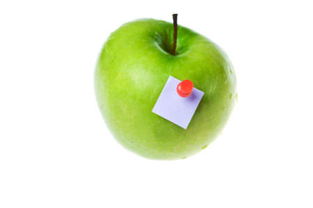 green apple with paper stickの写真素材