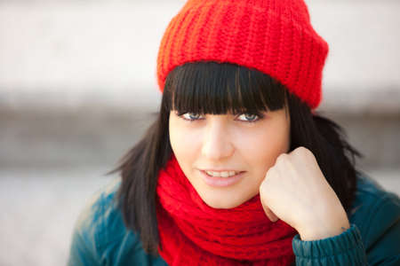 beautiful girl in red cap and scarfの写真素材