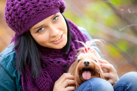 cute girl with small terrier dogの写真素材