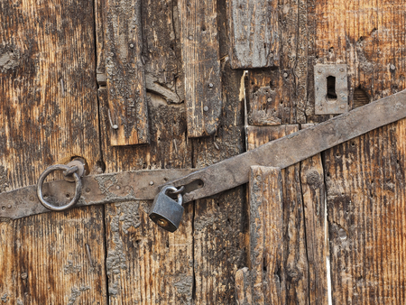 Old lock on very old doorの写真素材