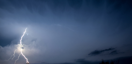 Lightning bolt in spring thunder storm at night in Southwest Texas