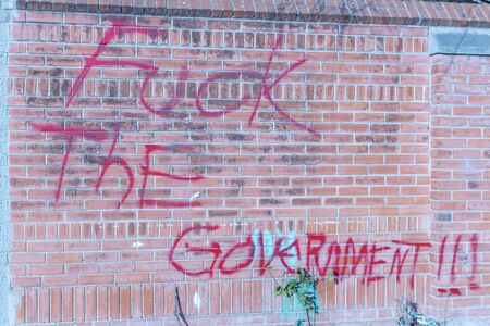 Eagle Pass, TX USA January 23, 2018 - graffiti on a brick wall in Eagle Pass, TX during United States government shutdown. Eagle Pass, TX (population 28,000) is located on the US Mexico border.のeditorial素材