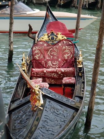 Venice - Rich decorations of the deck of a venetian gondola       の写真素材