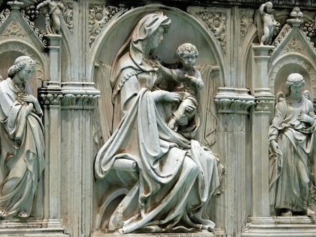 Madonna and Child with two angels. Panel of the Fonte Gaia (Fountain of Joy), Piazza del Campo, Siena.の写真素材