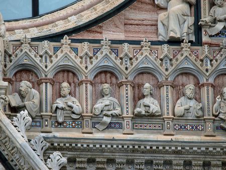 Architectural details of Duomo facade - Siena,Tuscany,Italy. The Duomo of Siena, which was built in the 12th and 13th centuries, is one of the prettiest churches in Gothic style in Italyの写真素材