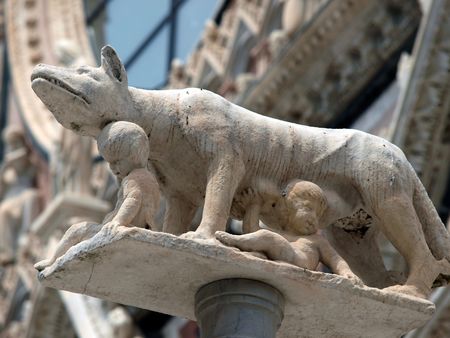 Siena - column with the she-wolf in front of the Duomo facadeの写真素材