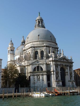 Basilica di Santa Maria Della Salute - Venice, Italy. Santa Maria Della Salute was built as a thanks or offering to the Virgin Mary against he plague which had taken almost a third of the Venice's population in 1630.の写真素材