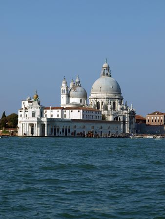 Basilica di Santa Maria Della Salute - Venice, Italy. Santa Maria Della Salute was built as a thanks or offering to the Virgin Mary against he plague which had taken almost a third of the Venice's population in 1630.の写真素材