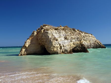 A section of the idyllic Praia de Rocha beach on the southern coast of the Portuguese Algarve region.の写真素材
