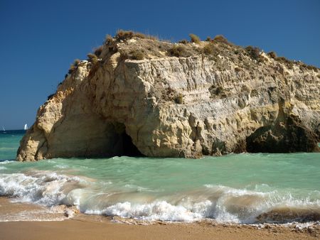 A section of the idyllic Praia de Rocha beach on the southern coast of the Portuguese Algarve region.の写真素材