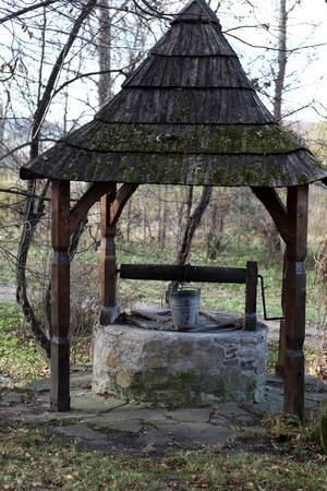 old well with a shingled roof の写真素材