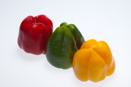 close up of red, yellow and green peppersの写真素材