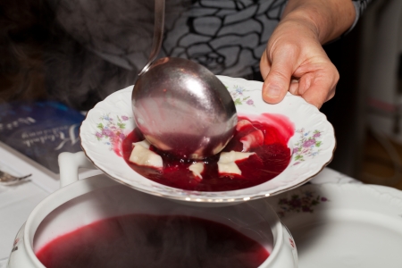 Red borscht with mushroom dumplings の写真素材