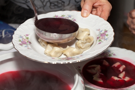 Red borscht with mushroom dumplings.の写真素材