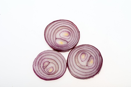 sliced onion isolated on white の写真素材