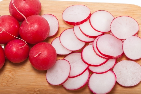 Garden radish on wooden board の写真素材