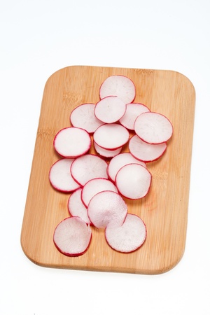 Garden radish on wooden board の写真素材