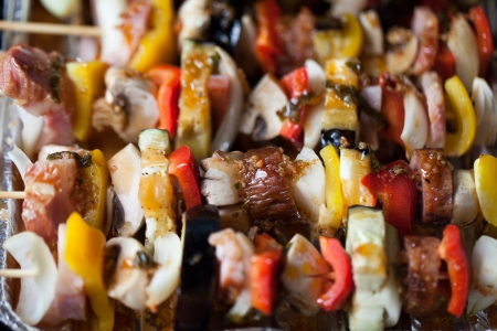 grilled chicken and colorful vegetable shashliks の写真素材