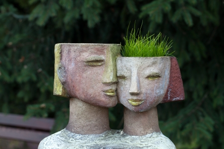 the flower pot in the form of the feminine headの写真素材