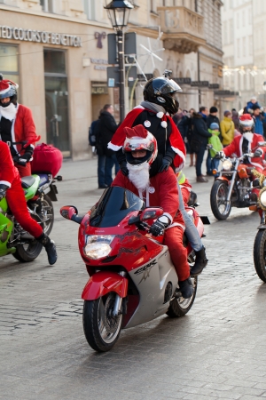 The parade of Santa Clauses on motorcycles around the Main Market Square in Cracowのeditorial素材