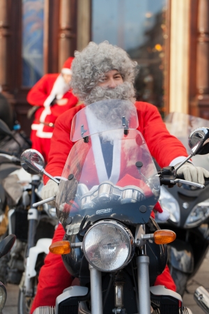The parade of Santa Clauses on motorcycles around the Main Market Square in Cracowのeditorial素材