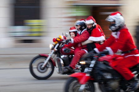 The parade of Santa Clauses on motorcycles around the Main Market Square in Cracowのeditorial素材