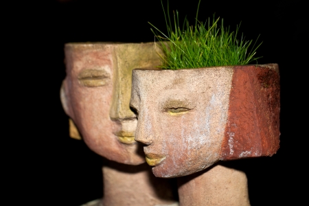 the flower pot in the form of the feminine headの写真素材