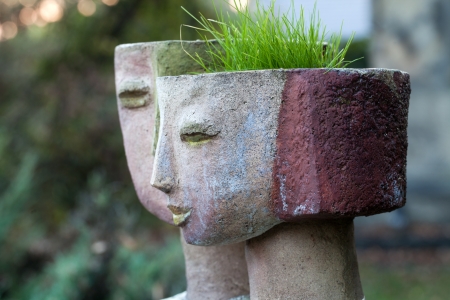 the flower pot in the form of the feminine headの写真素材