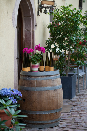 Street with half-timbered medieval houses in Eguisheim village along the famous wine route in Alsace, Franceの写真素材
