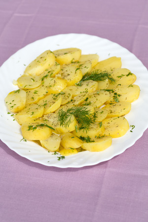 Delicious boiled potatoes with dill and oliveの写真素材