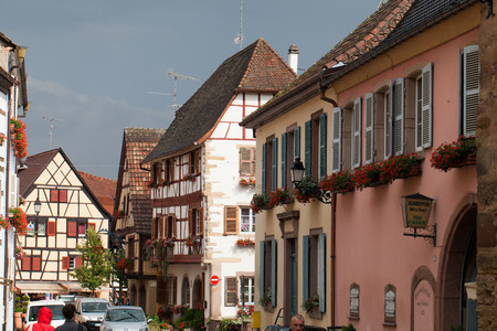Street with half-timbered medieval houses in Eguisheim village along the famous wine route in Alsace, Franceのeditorial素材