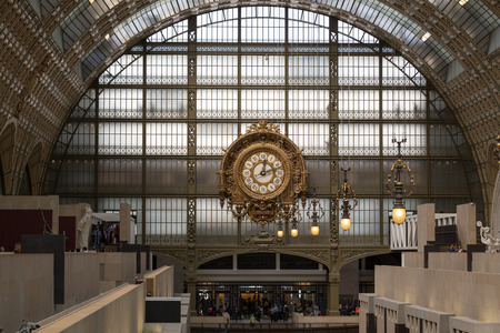 PARIS -SEPTEMBER 7, 2014: Golden clock of the museum D'Orsay in Paris, France. Musee d'Orsay has the largest collection of impressionist and post-impressionist paintings in the world. のeditorial素材